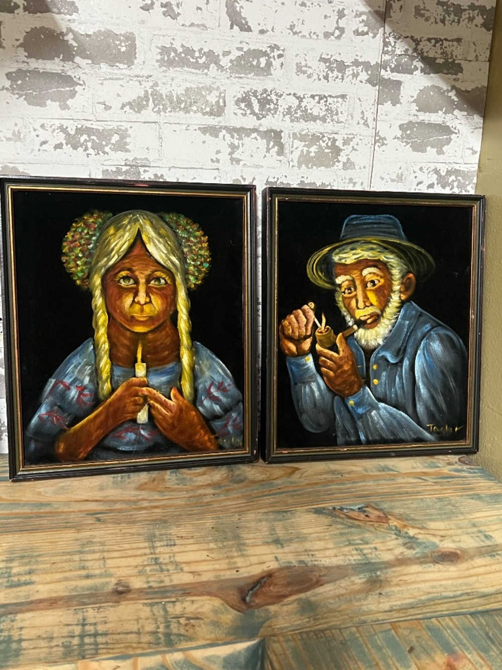 Vintage painting on a dark velvet-like fabric, featuring the stylized portrait